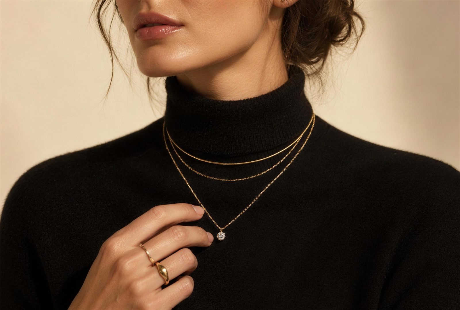 Maison Azure sample site: a woman wearing layered fine gold necklaces